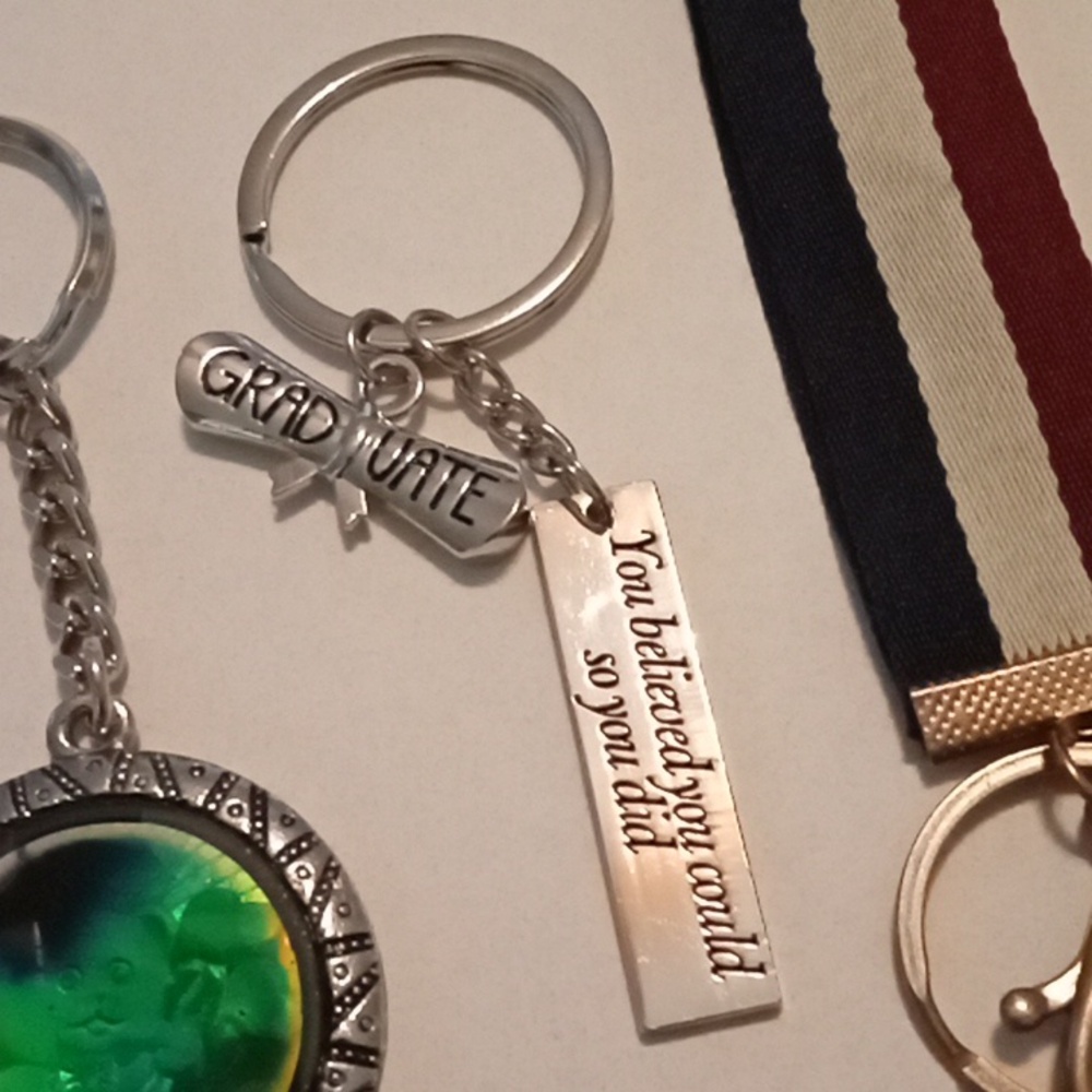 #697.  7 Piece Assorted Keychain Bundle - Picture 6 of 8